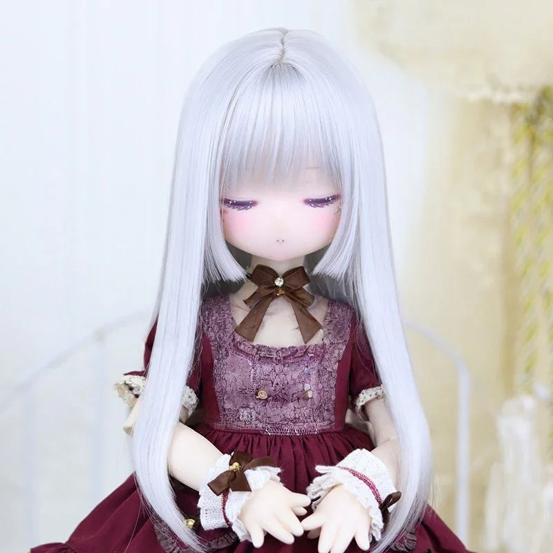 Ball-jointed doll with long silver hair wearing burgundy lace dress and brown bow